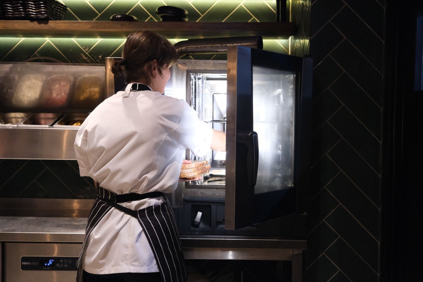 Chef using a stove in a restaurant