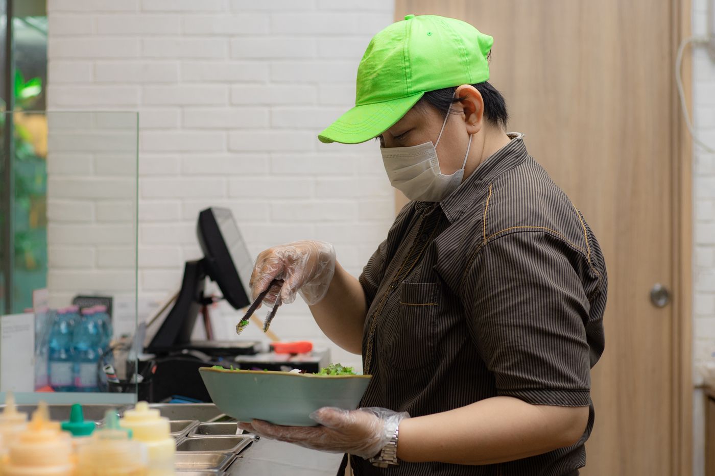 Chef preparing salad in a restaurant kitchen